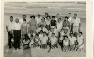 Vintage beach scene at historic Atlantic Beach, South Carolina, showing Black vacationers during the mid-20th-century resort era.