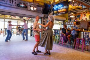 For decades, the Myrtle Beach Pavilion stood at the center of the Grand Strand’s entertainment culture, surrounded by the clubs, dance floors, arcades, and nightlife that helped make Myrtle Beach synonymous with Carolina Beach Music and the shag. This picture of couples swing dancing is indicative of how the legacy of beach music lives on in the Carolinas